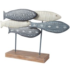 Bring a splash of coastal elegance to your home with our charming Fish Table Decoration