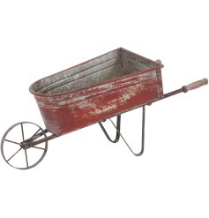 This Wooden Wheelbarrow Planter is an adorable way to display!