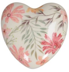 Charming heart ornament adds a touch of whimsy to any decor.