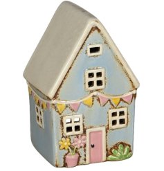 a pastel house perfect for putting candles in 