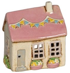 Elevate your home decor with a beautiful candle house - a stunning addition to any room.