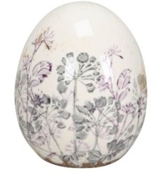 A gorgeous egg ornament detailed with a pastel pink and grey floral pattern.