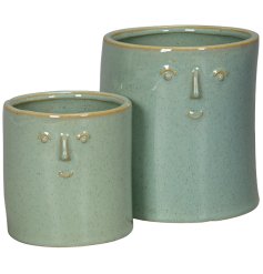 Add a touch of green to your plant collection with our 2-piece mint green face planters.