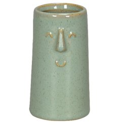 Brighten up your space with this playful vase featuring a cheerful green smiley face 