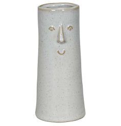 Showcase your flowers in style with this one-of-a-kind vase featuring a charming face design