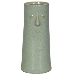 a unique tall vase with a smiley vase 