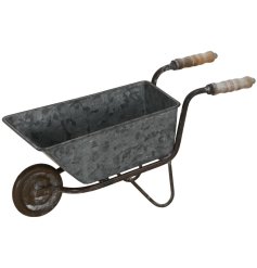 Add a rustic touch to your home with the Wheel Barrow Deco! Perfect for displaying plants and decor,