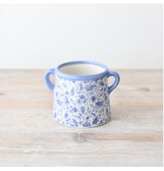 Add a pop of charm and elegance to your home with our charming Blue Hare Floral Pot,