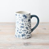 A gorgeous coastal jug adorned with patterns of sea creatures, shells and anchors.