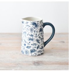 A gorgeous coastal jug adorned with patterns of sea creatures, shells and anchors.