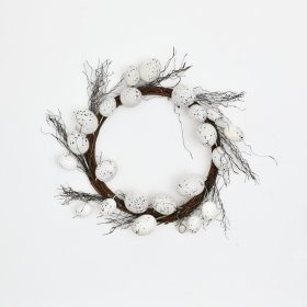 A festive egg-shaped wreath adorned with seasonal grasses, flowers, and charming Easter eggs!