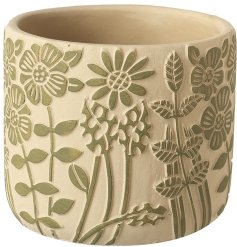 Add a touch of style to your home with our green floral planter. Perfect for showcasing your favourite plants.