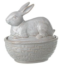 Transform your home into a whimsical wonderland with our Porcelain Rabbit In Basket Decoration