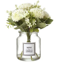 "Create a stunning display in your home with this elegant combination of white and green blossoms in a sleek glass vas