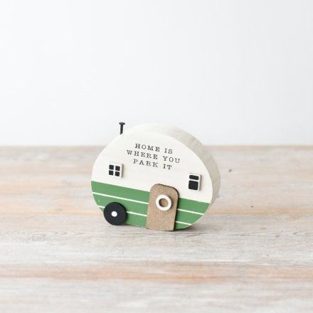 A shabby chic wooden caravan decoration with scripted text and a nail addition.