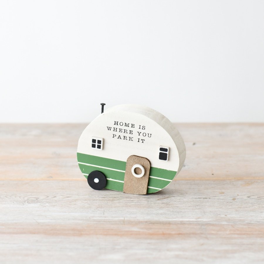 Capture the essence of shabby chic with this wooden caravan decor featuring script and a vintage nail accent.