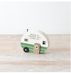 A shabby chic wooden caravan decoration with scripted text and a nail addition.