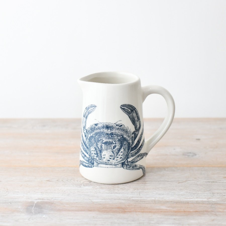 "Bring a touch of the coast home with this lovely dolomite jug featuring a charming blue crab design."