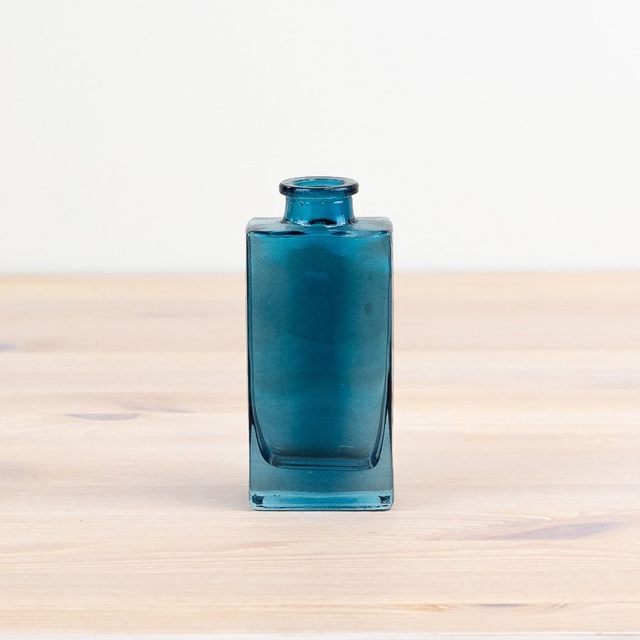 Elevate your decor with our chic Color Glass Vase, a vibrant and stylish addition to any room.