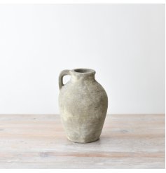 Elevate your interior with this essential accessory. Featuring a charmingly rustic surface in natural hues.