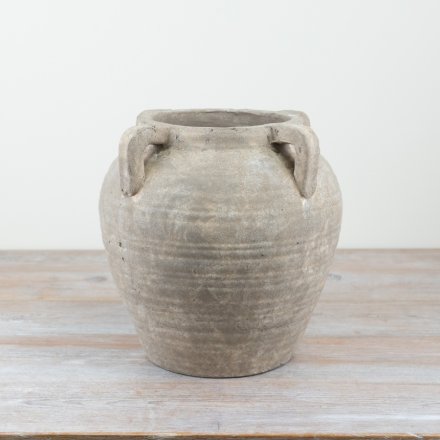Add a touch of rustic luxury to the home with this statement vase in a natural stone colour