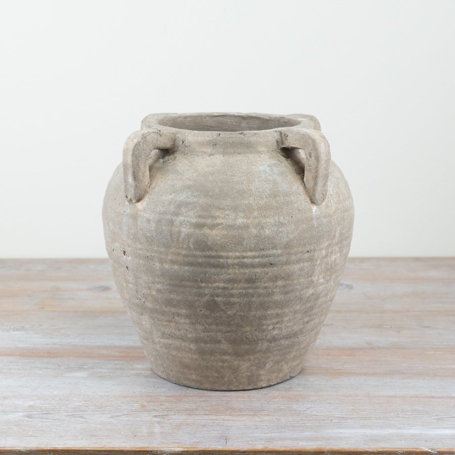 Bring a hint of rustic luxury to your home with a statement vase in a natural stone hue.