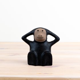 Add quirkiness to the space with this chic monkey figurine boasting a two-tone black and brown colour scheme. 