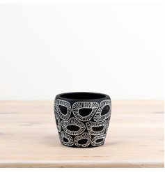 Add interest to your decor with this monochromatic patterned planter.