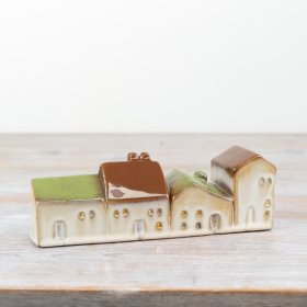 Brighten your space with our lovely ceramic house, featuring a built-in LED light.