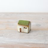 A rustic style ceramic house with integrated LED lights. Complete with a reactive glaze finish. 
