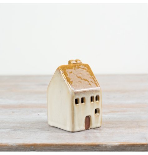 Brighten your decor with this 8cm LED ceramic house, adding a warm rustic charm to any space.