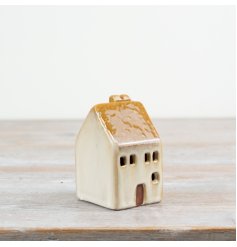 Brighten up any space with this 10cm LED ceramic house, adding a charming rustic touch to your decor.