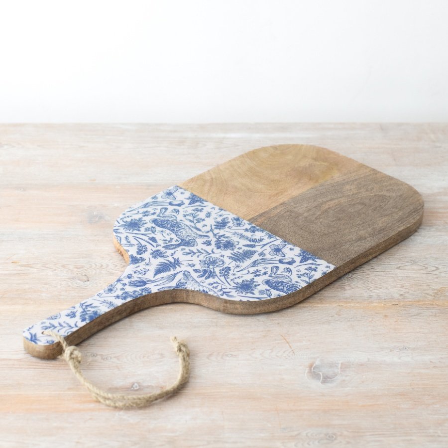 Upgrade your kitchen essentials with this unique wood board featuring a playful blue hare motif.