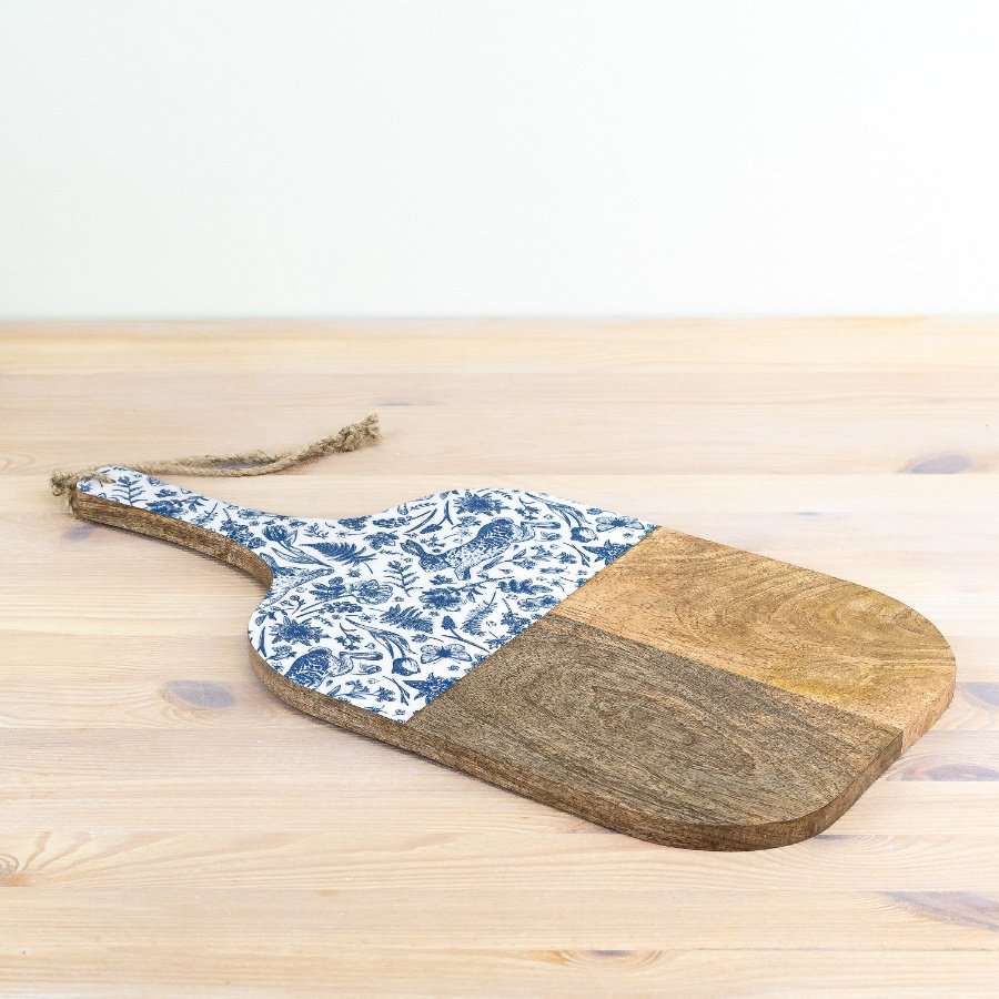 Upgrade your kitchen essentials with this unique wood board featuring a playful blue hare motif.