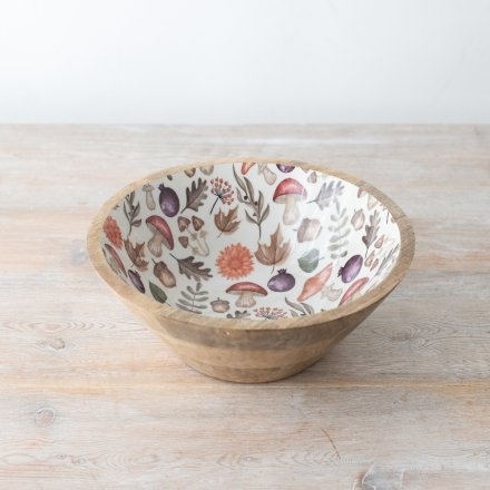 A whimsical wooden bowl adorned with a beautiful autumnal wooden pattern. 