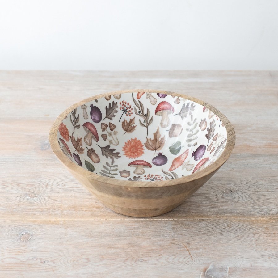 Add a touch of charm to your decor with a wooden bowl featuring a stunning autumn motif. Unique and stylish.