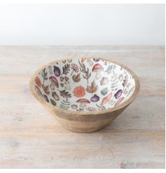 A whimsical wooden bowl adorned with a beautiful autumnal wooden pattern. 