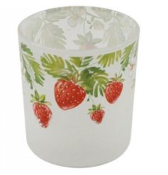 A dainty candler holder made from glass with pretty strawberry designs. 