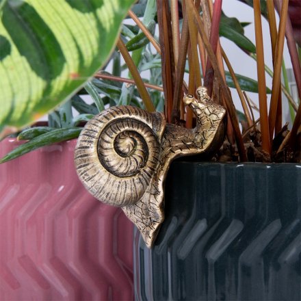 ad charm yo your planters with this snail pot pal 