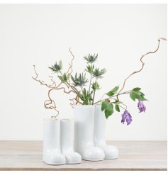 Adorable welly-inspired vase with a glossy finish. Perfect for adding a touch of whimsy to any flower display.