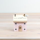 Welcome to this cozy "Home Sweet Home House" - the perfect touch of pink to brighten up any room! 