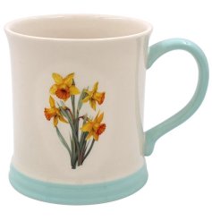  Bring a touch of spring into your home with the Daffodil Mug Embossed.