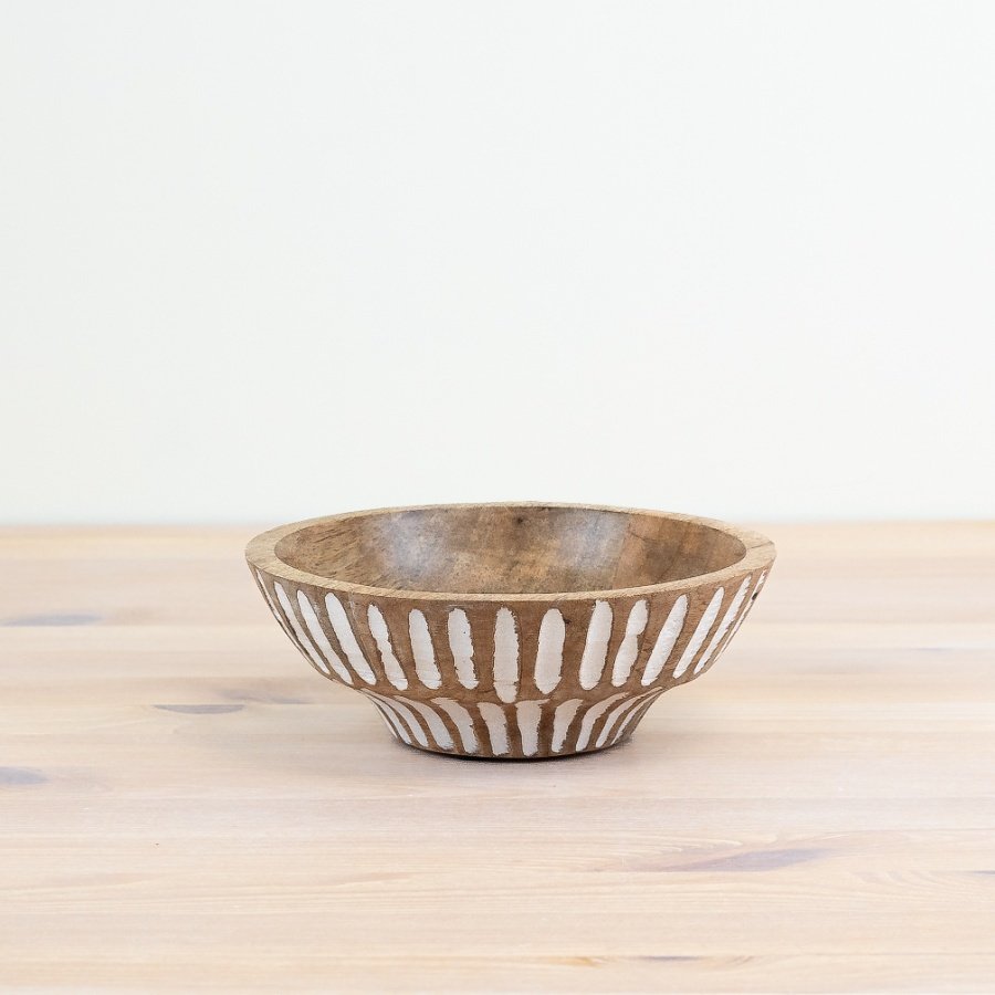 Bring rustic charm to your table with a patterned serving bowl.