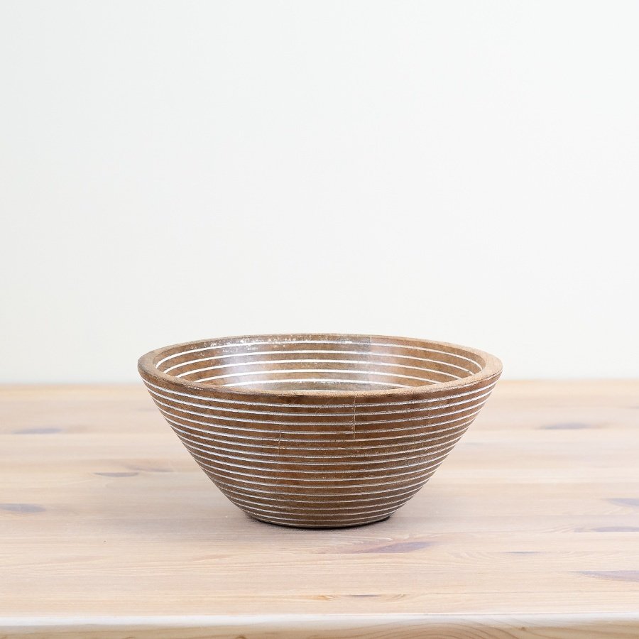 Elevate your dining experience with our chic wooden bowl, perfect for serving fresh salads.