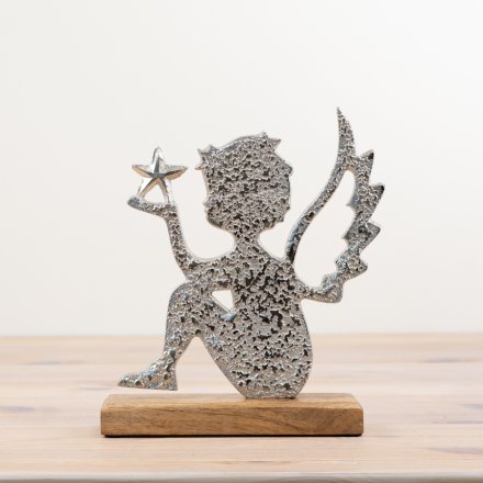 A chic angel ornament sat upon a rustic wooden base. Made from hammered aluminium with a star detail. 