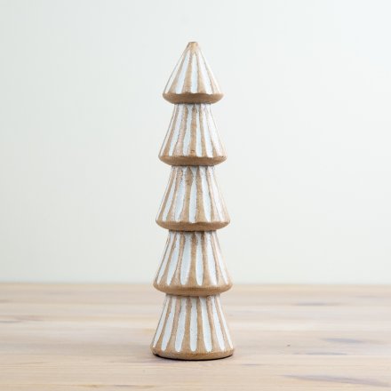 A chic mango wood tree with a carved pattern and white washed finish. 