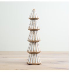 A chic mango wood tree with a carved pattern and white washed finish. 