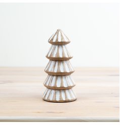 A beautifully crafted tree made from mango wood. Decorated in layers with a carved pattern and white washed finish.