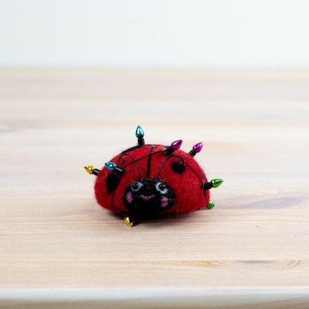 Add a touch of charm and whimsy to your home with our Wool Ladybird Table Deco.