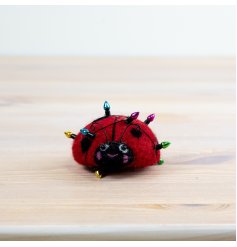 Add a touch of charm and whimsy to your home with our Wool Ladybird Table Deco.